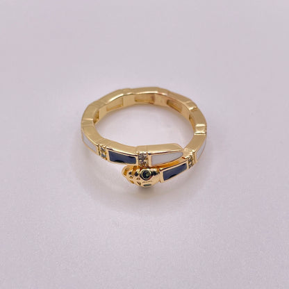 Gold snake ring - Black & Pearl White laying flat