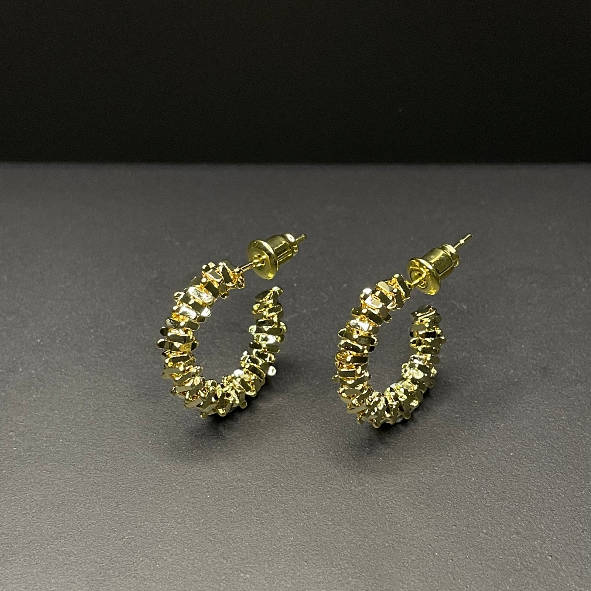 Ariella gold earrings standing