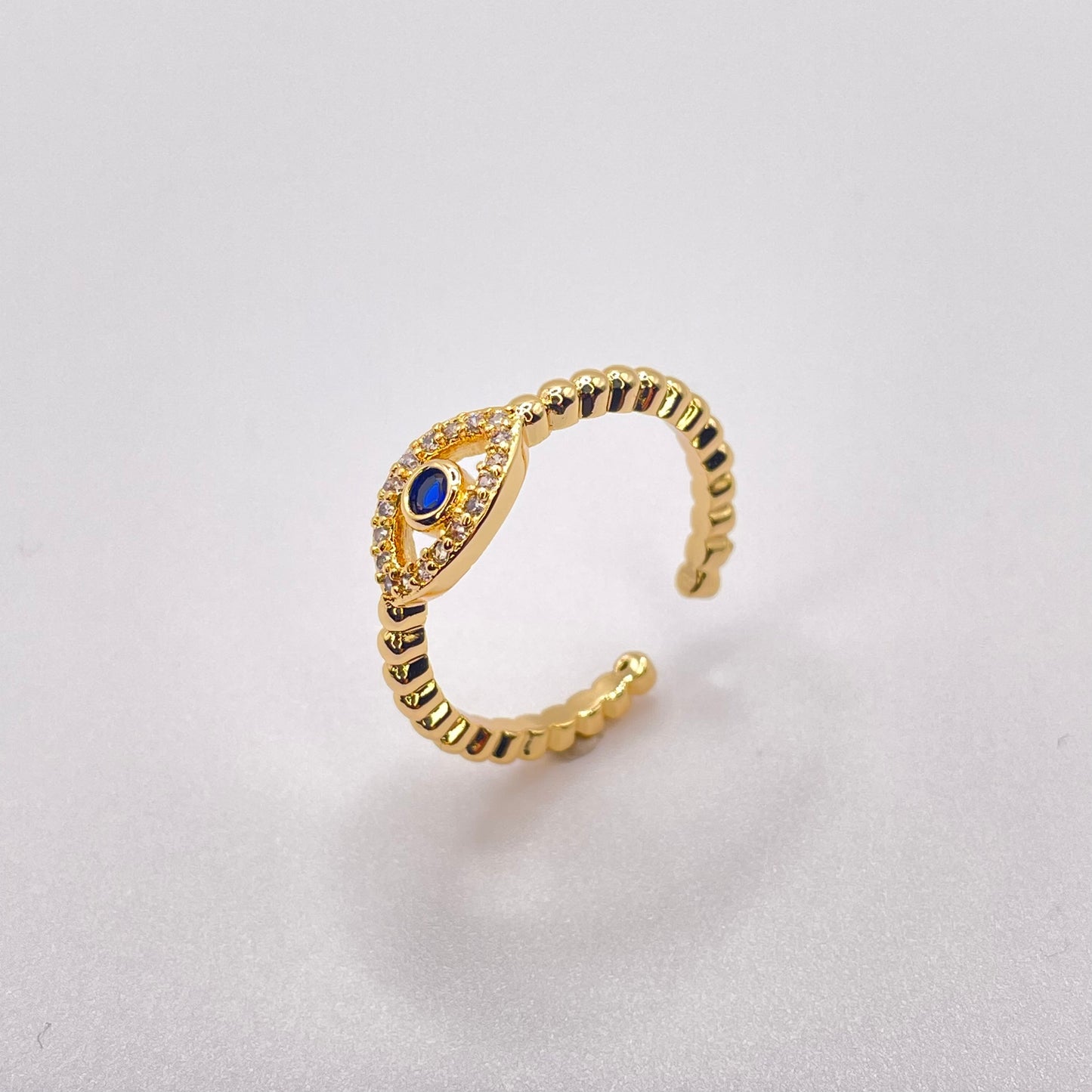 Blue zircon evil eye - Gold standing