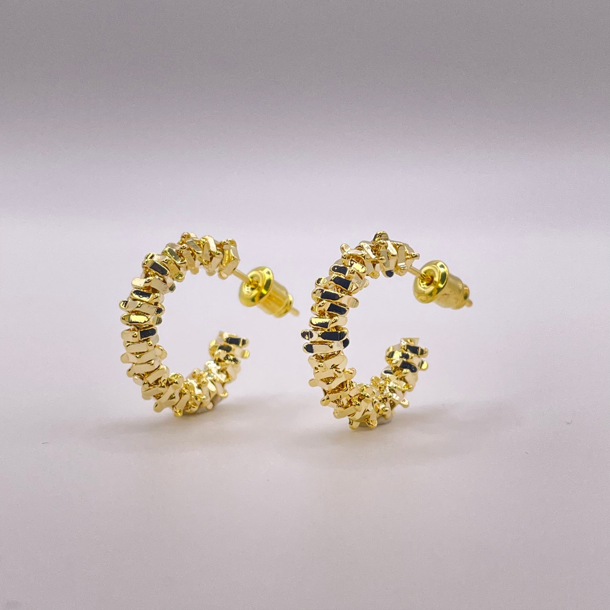 Ariella gold earrings standing